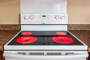 Glass electric stove with burners on