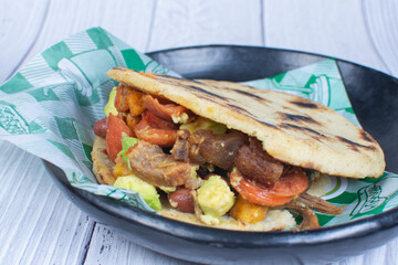Mix of Colombian corn arepas, traditional flavors with meat, vegetables and cheese