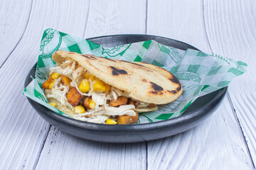 Mix of Colombian corn arepas, traditional flavors with meat, vegetables and cheese