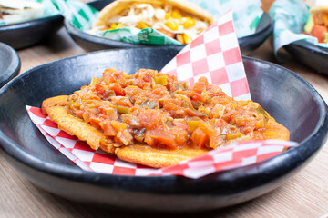 Mix of Colombian corn arepas, traditional flavors with meat, vegetables and cheese