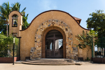 Chapel of Santa Cruz in Huatulco, Oaxaca, Mexico. Famous for wood cross relic. A bearded man...