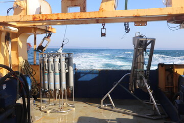 marine scientific equipment on boat with sea in background 