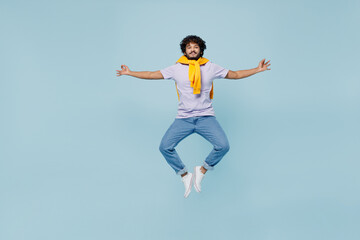 Full size young bearded Indian man 20s years old wears white t-shirt hold spreading hands in yoga om aum gesture relax try to calm down isolated on plain pastel light blue background studio portrait.