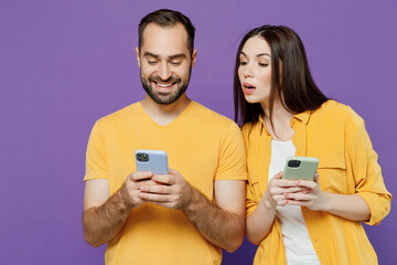 Young jelaous couple two friends family man woman together in yellow casual clothes hold in hand...