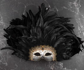 black theatrical mask on a black background - obrazy, fototapety, plakaty