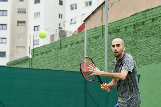 Amateur Tennis Player Learns To Hit Forehand With Ball And Racket