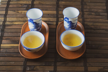tea set on a table with a bamboo substrate
