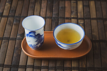 tea set on a table with a bamboo substrate