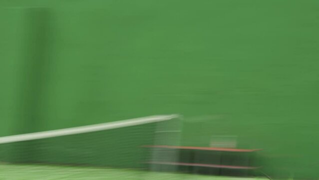 Forehand and backhand hits during tennis game between two male players
