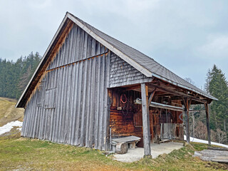 Mountain huts (chalets) or farmhouses and old wooden cattle houses in the valley of W&auml;gital or Waegital and by the alpine Lake W&auml;gitalersee (Waegitalersee or Wagitalersee), Innerthal - Switzerland