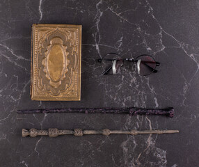 magic wands, magic book on a black background