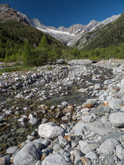 Alpine Val Sissone valley with river and mountains