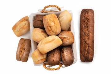Above view of fresh wheat and rye buns in a wicker basket isolated on a white background