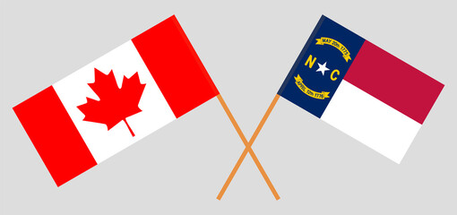 Crossed flags of Canada and The State of North Carolina. Official colors. Correct proportion