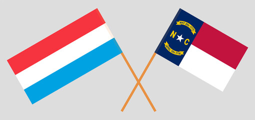 Crossed flags of Luxembourg and The State of North Carolina. Official colors. Correct proportion