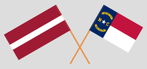 Crossed flags of Latvia and The State of North Carolina. Official colors. Correct proportion