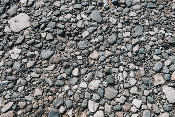 Stones. Stones on the shore. Stone coast. Sandy shore. Sea shore. The texture of the stones. Background from stones. Small pebbles on the beach
