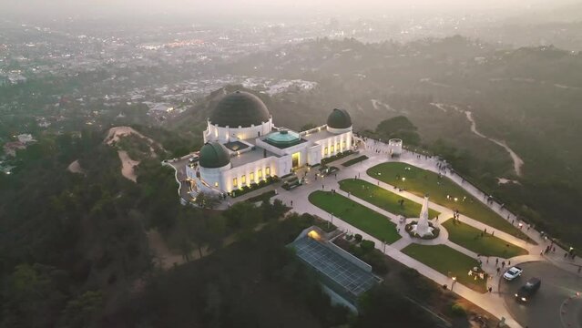 Aerial drone shot. Night Los Angeles. flying over Griffith Observatory. Los Angeles landscape. California landmark, travel destination in America.