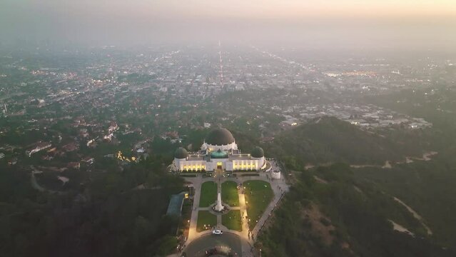 Drone aerial shot 4k. Griffith observatory. Los Angeles skyline at night. California landmark, travel destination in America. popular tourist city in USA.