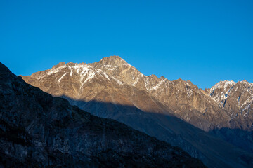 Mountain ridge against blue sky