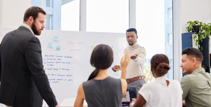 Yes, you wanted to say something. Shot of a young businessman giving a presentation to his colleagues in an office.