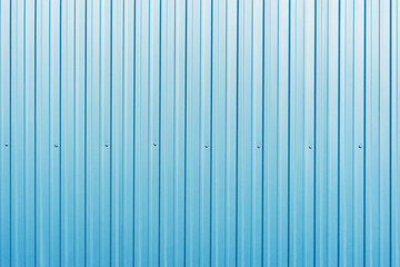 White and blue corrugated metal fence.