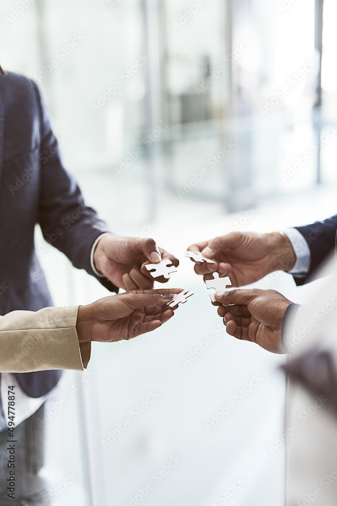 Aufkleber building on their collective vision. closeup shot of a group of unrecognizable businesspeople joinin