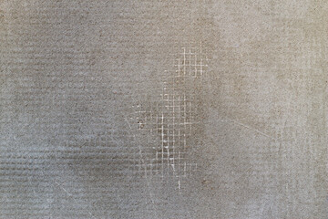 grey plastered wall as a textured background