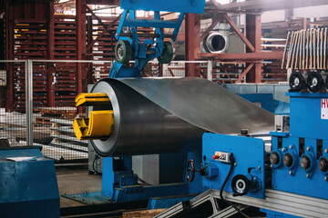 Roll of galvanized steel sheet at metalworking production line - obrazy, fototapety, plakaty