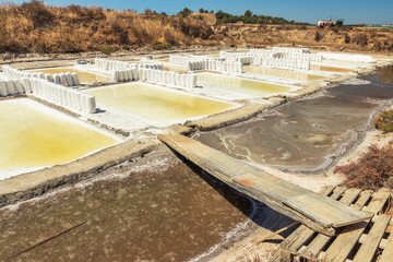 View of the Castro Marim salt pans in the Algarve, Portugal, with bags full of salt in the middle...