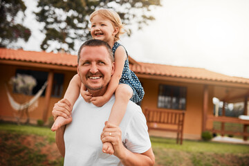 Hes always got time for his daughter. Cropped shot of a mature man carrying his young daughter on...