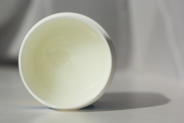 Closeup of a tub of petroleum jelly.