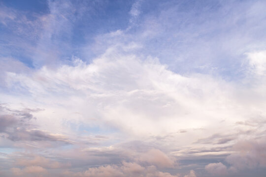 Beautiful epic soft gentle cloudy blue sky with many white cirrus and fluffy clouds, abstract background texture, heaven