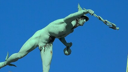 Sculpture of a naked man on the roof of the house. Copenhagen. Denmark.