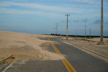 Road covered by sand dunes. Near Paulino Neves, state of Maranhão, Brazil.