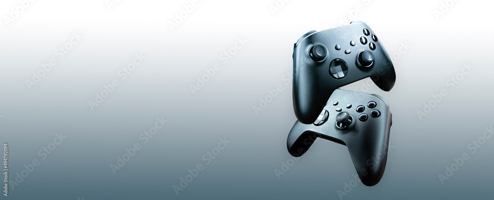 Poster 2 game controllers floating on gradient background - future of gaming concept