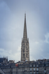Fototapeta na wymiar Panorama of the old town of Bordeaux, France, with the the tower of the Basilique Saint Michel basilica a cloudy afternoon in winter. it is a gothic catholic cathedral basilica...