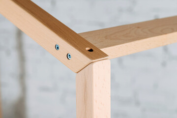 The image of the child's bed, plank joints, details against the backdrop of the white ceiling.