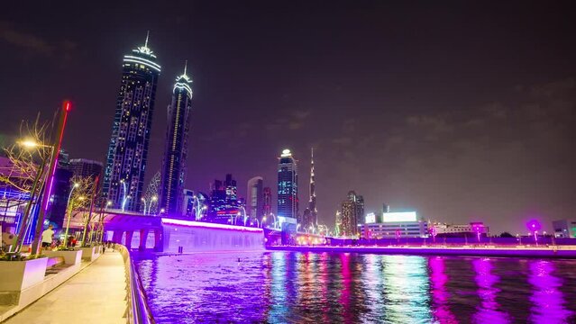 dubai night light famous water canal side walk downtown panorama 4k time lapse uae
