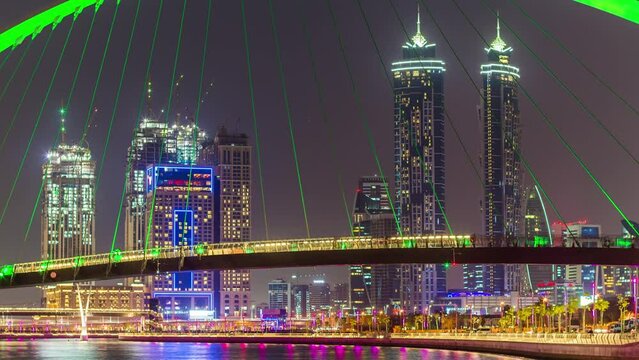 night dubai water canal crossing bridge downtown panorama 4k time lapse uae