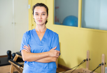 Portrait of benevolent female healthcare professional in the recovery and pilates room