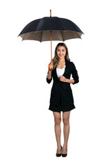 Businesswoman in black suit stands with an umbrella over her head.