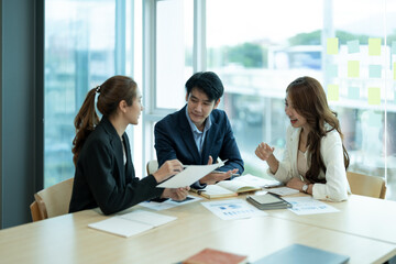 Happy group of business asian work cooperate with diverse team at office briefing, focused biracial...