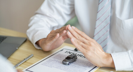 Loss Adjuster Insurance Agent Inspecting Damaged Car. .Sales manager giving advice application form document considering mortgage loan offer for car  insurance