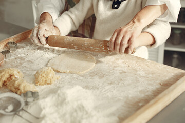 Family cook the dough for cookies