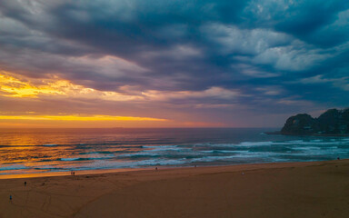 Sunrise reflections and clouds at the seaside with lagoon
