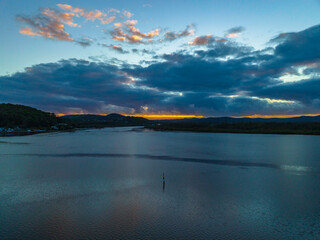 Sunrise and rain clouds waterscape