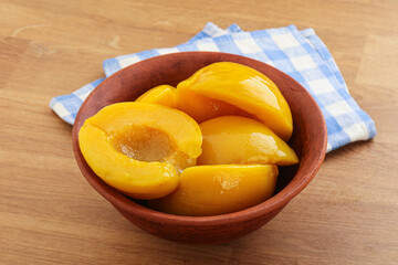 Sweet canned peaches with syrope