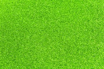 Lime glitter twinkle abstract spring or summer holiday background with sparkles. Modern luxury mock up with sequins. Texture of colored porous rubber with spangles