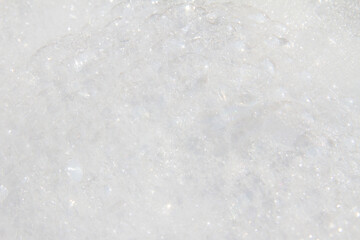 Abstract white  colors background of bokeh lights or bubbles in soft spring colors. Shampoo bubbles texture.
